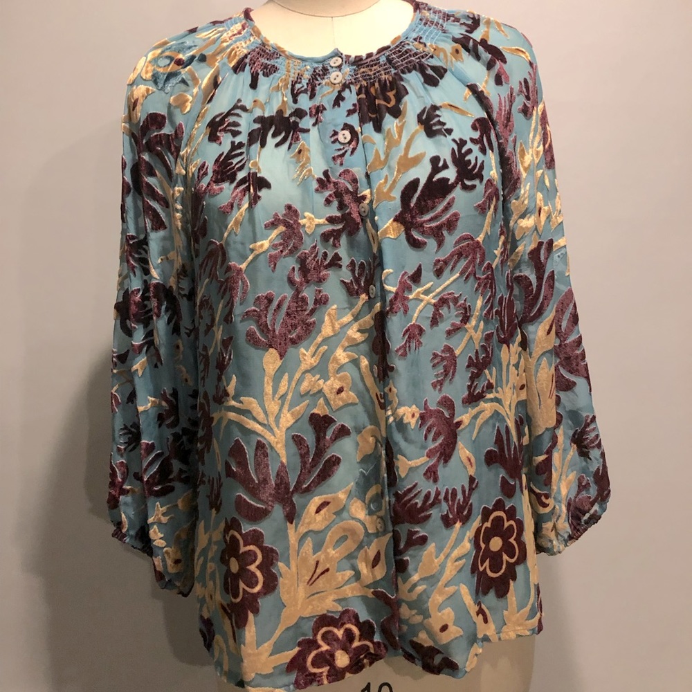 Sunset Crushed Velvet in a sky blue with wine and gold accents.